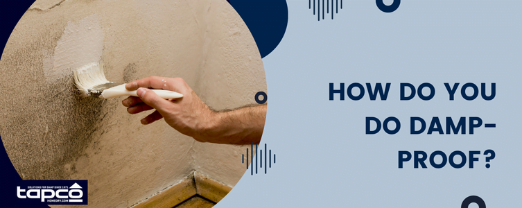 Man treating damp wall