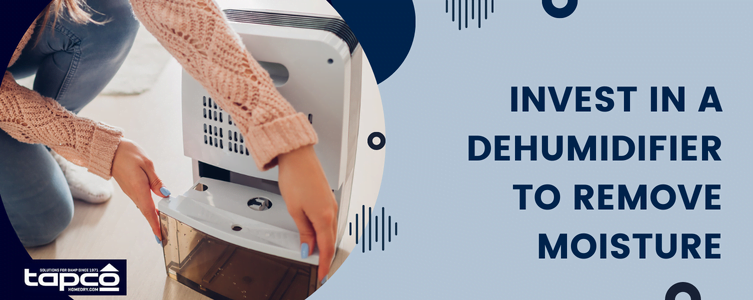 Woman emptying dehumidifier tank